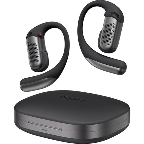 Shokz OpenFit Pro black open-ear wireless Bluetooth earbuds with gray perforated speaker pods and curved ear hooks, displayed with matching black and gray charging case