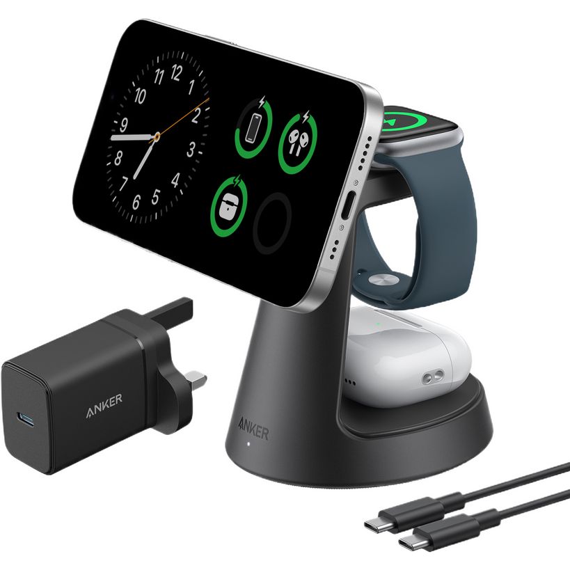 Anker MagGo 3-in-1 wireless charging station with black stand holding smartphone and smartwatch, includes gray power bank, black USB-C charger and cable on white background