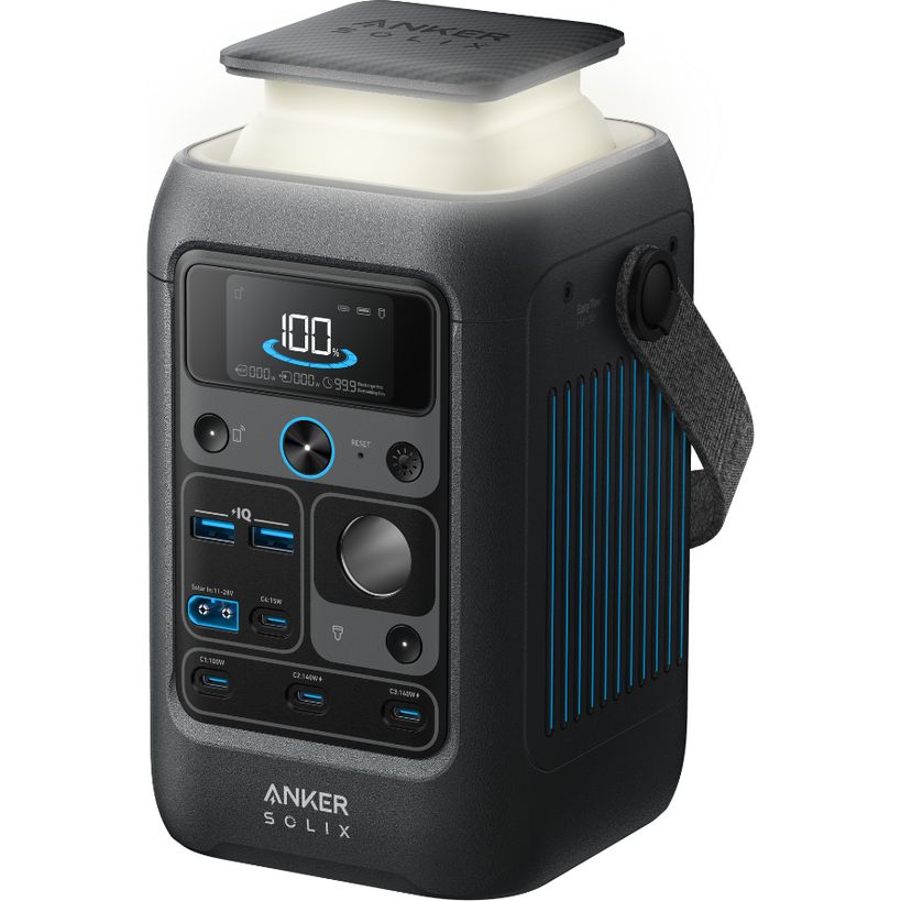 Anker Solix C300X portable power station with 300W capacity, featuring a dark grey textured body with cream-colored top panel, digital display showing 100W output, multiple USB ports, control buttons with blue accents, carrying handle, and vertical cooling fins on the side