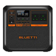 Bluetti AC180P portable power station with 1800W output and 1440Wh capacity, featuring black casing with orange accents, digital display screen, control knobs, and multiple green power outlet indicators on front panel