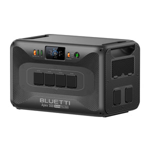 Bluetti Apex 300 portable power station with 3840W capacity in dark gray with carbon fiber textured finish, featuring digital display panel, four AC output sockets, side ventilation grilles, and status indicator lights on top