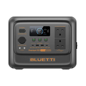 Bluetti Premium 100 V2 portable power station 2000W 1024Wh with dark gray casing, digital display showing 100W output, DC and AC input/output ports, USB charging ports, AC outlets, and control buttons on front panel