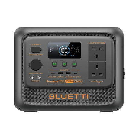 Bluetti Premium 100 V2 portable power station 2000W 1024Wh with dark gray casing, digital display showing 100W output, DC and AC input/output ports, USB charging ports, AC outlets, and control buttons on front panel