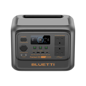 Bluetti Premium 100 V2 portable power station with 2000W output and 1024Wh capacity, featuring gray housing with black control panel, digital display showing 100W output, AC power outlets, DC inputs, USB ports, and orange accent text on dark background
