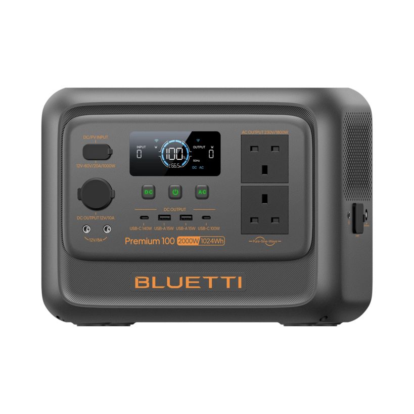 Bluetti Premium 100 V2 portable power station with 2000W 1024Wh capacity, featuring dark gray casing with orange accents, digital display showing 100W output, AC outlets, USB ports, and DC input/output connections on front panel