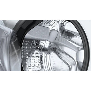 Close-up interior view of Bosch Series 6 washing machine drum showing stainless steel perforated basket with water droplets and black rubber seal ring