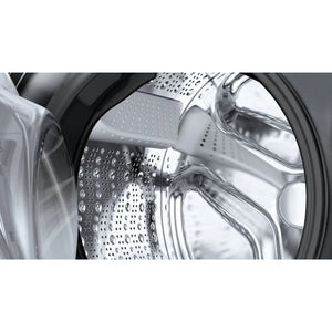 Close-up interior view of Bosch Series 6 washing machine drum showing stainless steel perforated drum with water droplets and silver metal components against graphite gray exterior casing