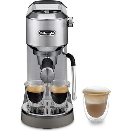 DeLonghi Dedica Duo stainless steel espresso coffee machine with dual cup holders, steam wand, and single-serve glass cup shown to the right