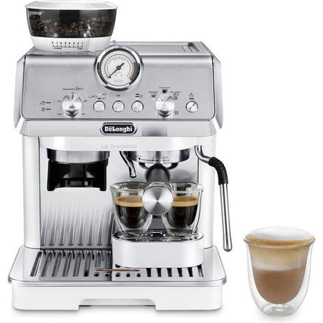 DeLonghi La Specialista Arte white bean to cup espresso machine with built-in grinder, pressure gauge, dual spouts dispensing coffee into glass cups, and a cappuccino cup beside it on white background