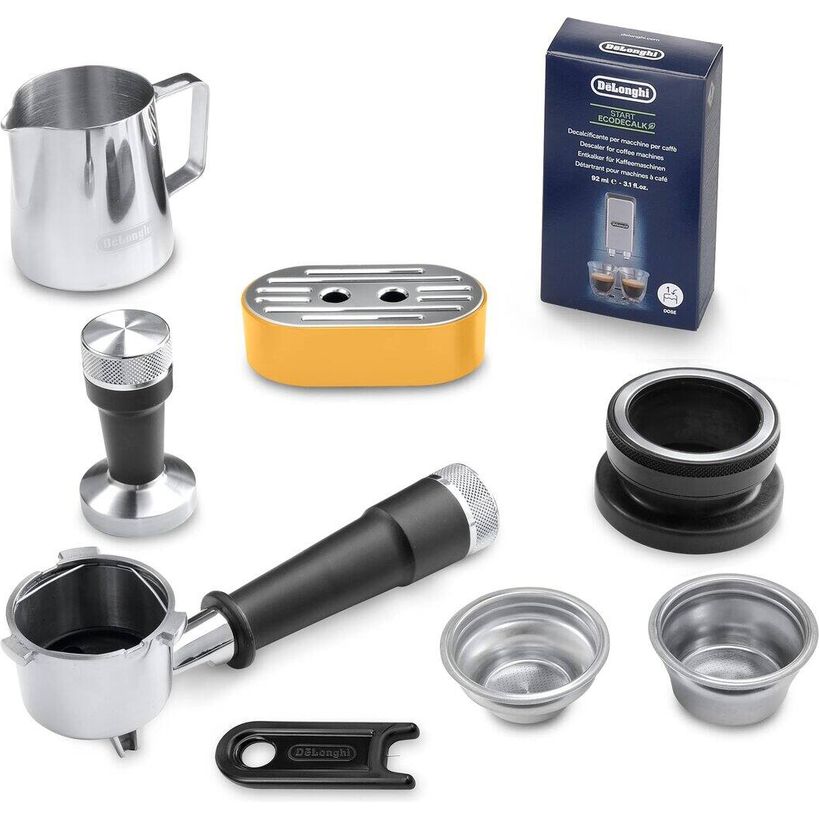 Delonghi La Specialista Arte manual espresso machine accessories kit in yellow and black including stainless steel milk frother, tamper, portafilter, shower head, baskets and cleaning tools displayed on white background