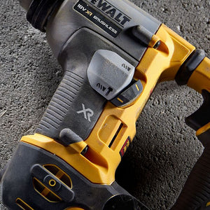 DeWalt DCH172P2 compact XR SDS Plus rotary hammer drill in yellow and black with 18V brushless motor, shown from angled top view on concrete surface