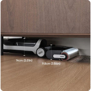 Dreame H14 Pro wet and dry vacuum cleaner with white and black body positioned under wooden furniture showing 14cm and 9.8cm clearance measurements on wooden floor