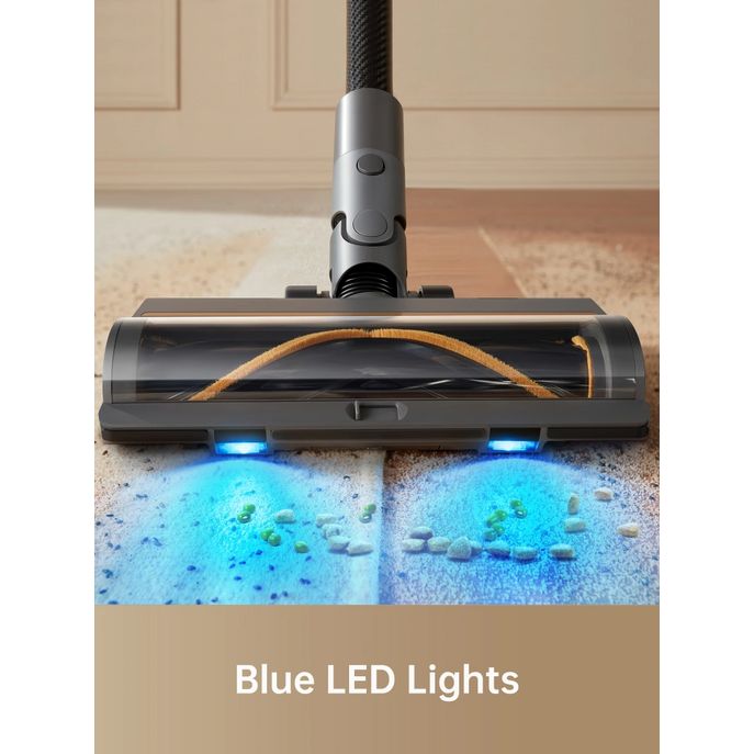 Dreame R20 cordless stick vacuum with motorized brush head featuring blue LED lights illuminating dust and debris on carpet, showing silver and black design with rope attachment visible