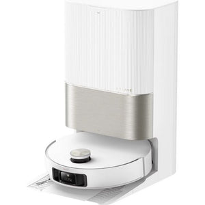 Dreame X50 Ultra robot vacuum cleaner in white with stainless steel dust bin, shown docking at its white charging station with visible sensor on top