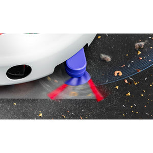 Blue and red Dyson R2 Nurovi robot vacuum with wet and dry cleaning function shown cleaning dark asphalt with scattered debris and leaves, demonstrating dual red laser cleaning jets in action beneath white car