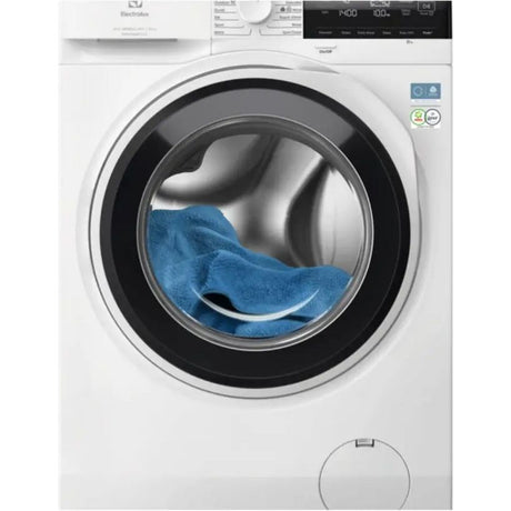 Electrolux white front-load washing machine with 10kg capacity, 1400 spin speed, showing blue towels in the black-rimmed drum, digital display panel on top, and universal dose feature