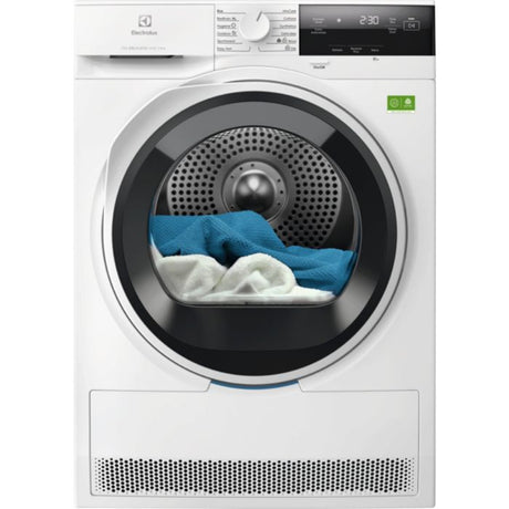 Electrolux 9kg white heat pump tumble dryer with black drum door open showing blue and white laundry inside, digital display showing 230 minutes, perforated metal base and green energy rating indicator visible