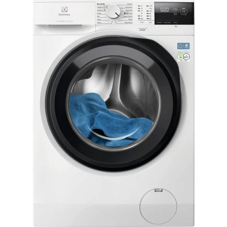Electrolux Sensicare white front-load washing machine with 10kg capacity, 1400 spin speed, black circular door frame, digital display panel, and blue towel visible inside drum