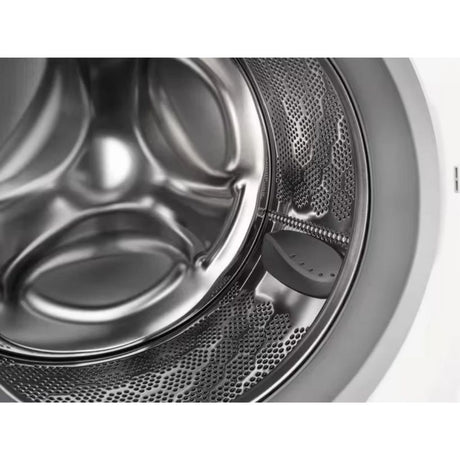 Close-up detail of Electrolux Sensicare washing machine drum showing stainless steel interior, perforated metal drum basket, and white exterior casing with open door mechanism