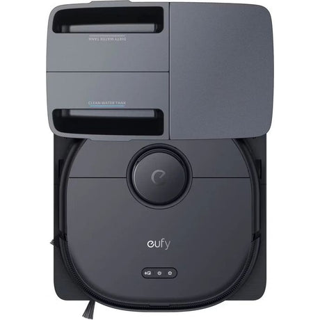 Eufy X10 Omni Pro robot vacuum and mop in dark gray and black with docking station, featuring circular camera lens, clean water tank compartment, and control buttons on front base