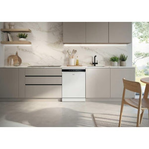 White Haier I Pro Shine Series 3 dishwasher integrated into modern grey and white kitchen cabinetry with marble backsplash, wooden shelving, and natural light from window