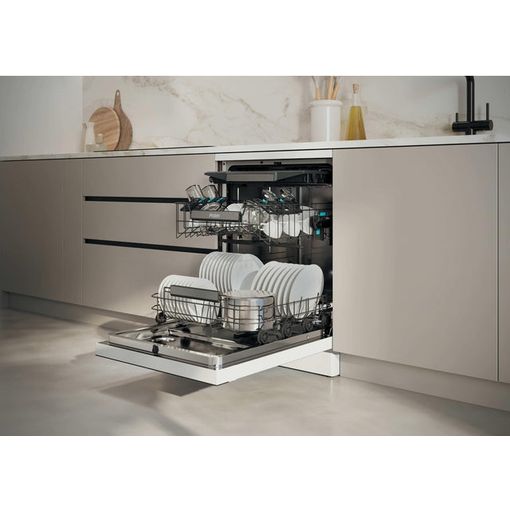 Haier I Pro Shine Series 3 white freestanding dishwasher with open door displaying full load of white plates and dishes in modern kitchen with beige cabinetry