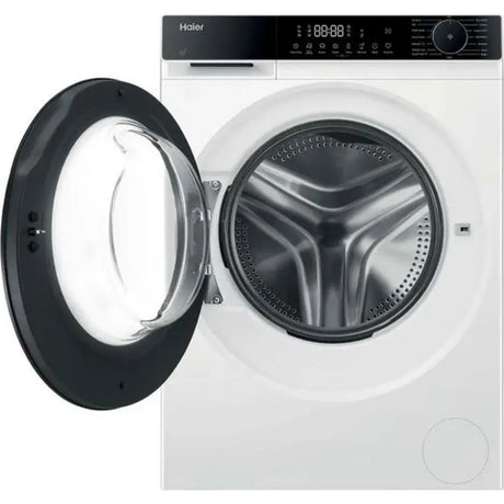 Haier X Series 5 white front-load washing machine with 9kg capacity and 1400 spin, showing open black door with stainless steel drum, digital display panel and control dial on top