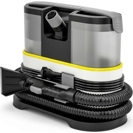 Karcher SE 2 Spot Care compact carpet cleaner with gray and black body, yellow safety band, coiled black hose with spray attachment and brush head on white background