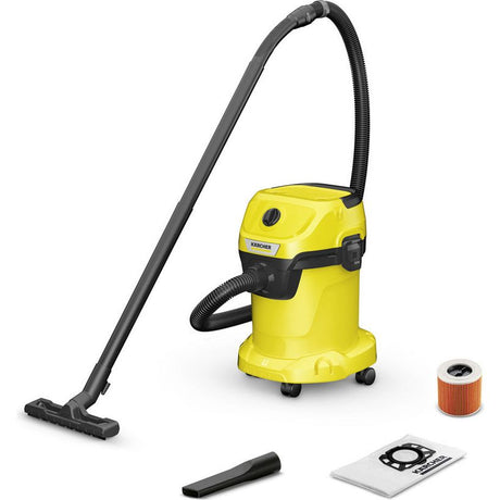 Kärcher WD 3 wet and dry vacuum cleaner in bright yellow and black with flexible hose, floor nozzle, replacement filter cartridge and dust bag accessories displayed on white background
