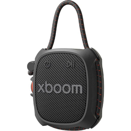 LG Xboom Rock portable Bluetooth speaker in black with textured mesh front panel, carrying handle with red and black checkered strap, and red accent details on the side