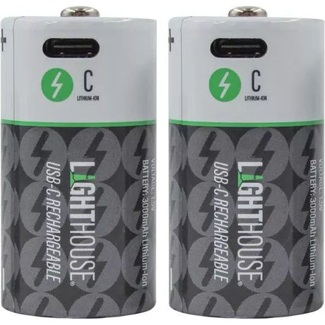 Two Lighthouse USB-C rechargeable C batteries with lithium-ion technology, featuring white tops with green lightning bolt logos and black lower sections with repeating battery icons, displayed side by side