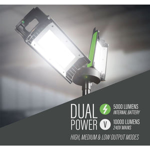 Lighthouse dual power rechargeable site light on stand with green accents showing 5000 lumens internal battery and 10000 lumens 240V mains power modes, featuring high medium and low output settings against cloudy sky background