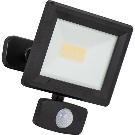 Black outdoor LED floodlight with PIR motion sensor and adjustable tilt mount, featuring white lens and warm white LED panel, 20W Luceco Essence model