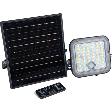 Luceco Mensa black solar powered LED floodlight with PIR motion sensor showing large solar panel, rectangular light head with multiple LED bulbs, and black remote control