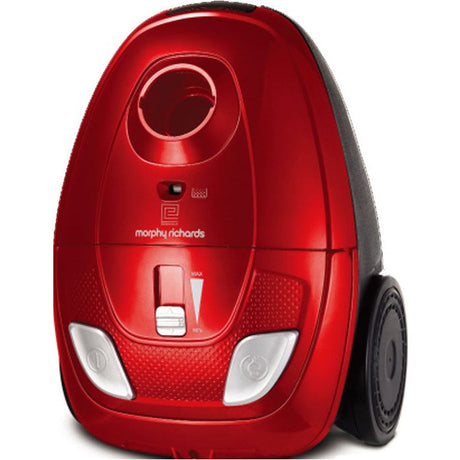 Red and black Morphy Richards Essentials bagged vacuum cleaner with white accents, featuring a rounded capsule design, front control panel, and wheels