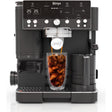 Ninja Luxe Café Premier Series black coffee machine dispensing cold brew into a clear glass cup, featuring digital display, multiple control buttons and knobs, stainless steel accents, and dual water reservoirs on either side