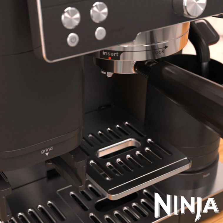 Ninja Luxe Café Premier Series black coffee machine with stainless steel portafilter and drip tray, featuring control panel with knobs and buttons, shown from front angle on wooden surface