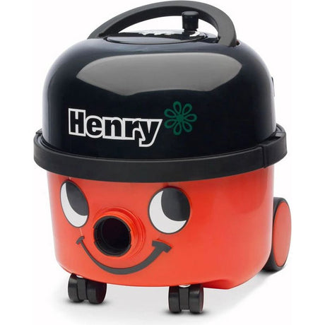 Numatic Henry HVR200 compact vacuum cleaner with red cylindrical body, black top lid, smiling face design, white eyes, carrying handle and black wheels