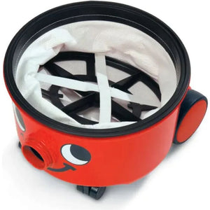Red Numatic Henry vacuum cleaner with black trim, white cloth bag straps, and characteristic smiling face design on the cylindrical body with wheels visible at the base