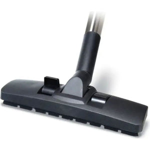 Black Numatic Henry vacuum cleaner floor brush head attachment with grey circular housing and flexible hose connection against white background