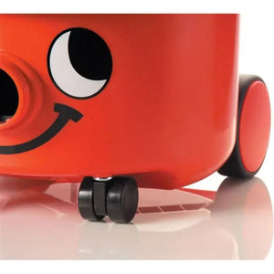 Red Numatic Henry vacuum cleaner with smiling face design, black wheels and caster, shown in 3D render against white background