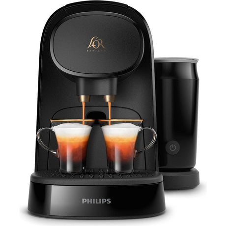Philips L'OR Barista deep black capsule coffee machine with dual espresso cups filled with coffee, milk frother attachment on right side, and gold L'OR branding on top