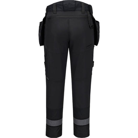 Back view of Portwest DX4 black work trousers with detachable holster pockets, reflective ankle strips and reinforced knee pad areas, waist 36