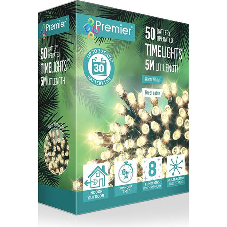 Premier 50 battery operated LED timelights with warm white bulbs on green cable, 5m length, displayed in retail packaging with tropical palm leaf design showing features including 6-hour timer, 8 functions, and 30-day battery life