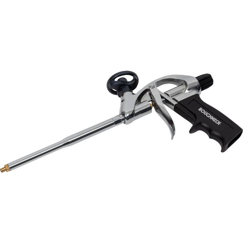 Roughneck expanding foam gun with chrome metal barrel and black plastic trigger handle, featuring a brass nozzle tip and black comfort grip