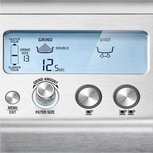 Close-up of Sage Barista Pro espresso machine control panel showing digital display with grind settings, grind size 13, double shot option, 12.5 second timer, filter size dial, and single and double shot buttons on brushed stainless steel surface