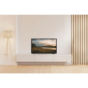 Samsung 32 inch HD LED smart TV mounted on white wall unit in minimalist living room with wooden flooring, beige tripod lamp and vertical blinds