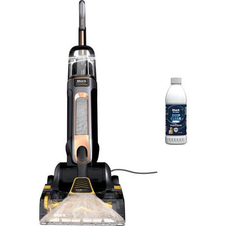 Shark CarpetForce HairPro upright carpet cleaner in black and copper with transparent dirty water tank, shown with included bottle of Shark solution cleaner