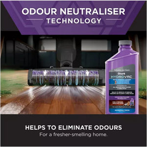 Shark HydroVac multi-surface floor cleaner bottle with purple label next to Shark cordless vacuum cleaner with purple brush roll cleaning wet hardwood floor, demonstrating odour neutraliser technology for eliminating household odours