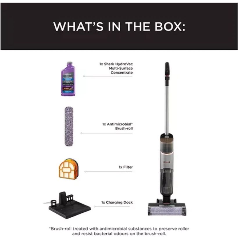 Product contents diagram for Shark HydroVac cordless vacuum showing purple multi-surface concentrate bottle, gray antimicrobial brush roll, orange filter, black charging dock, and black and silver upright vacuum cleaner on white background with labeled components